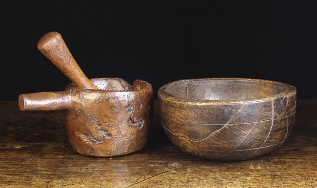 A Rustic Dug-out Mortar & Pestle, and a turned Elm Bowl (A/F).