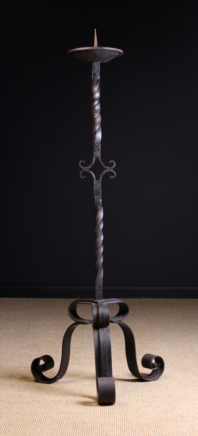 A Painted Wrought Iron Floor Standing Pricket Stick on tripod base.