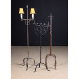 Three Wrought Iron Standard Lamps: A Pricket.