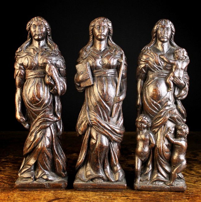 A Set of Three 17th Century Flemish Carved Oak Allegorical Pilasters/Finial Figures personifying