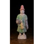 A Chinese Ming Dynasty Pottery Attendant Tomb Figure Circa 1450-1550,