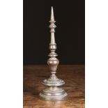 A Small 17th Century Heavy Cast Bronze Pricket Stick with knopped stem, 11 ins (28 cms) in height.