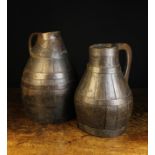 A Pair of Large 18th/Early 19th Century Coopered Oak Jugs bound in iron straps;
