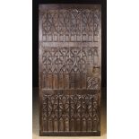 A Late 15th Century Carved Oak Door enriched with Gothic Tracery,