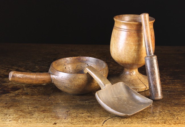 Three Pieces of Treen: An early 19th century turned fruitwood Pestle & Mortar;