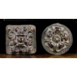 Two Small Carved Wooden Bosses mounted on lead plaques: a Tudor rose 3 ins (8 cms) in diameter,