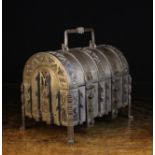 A 19th Century German Dome-topped Steel Casket bound in decoratively pierced straps backed in