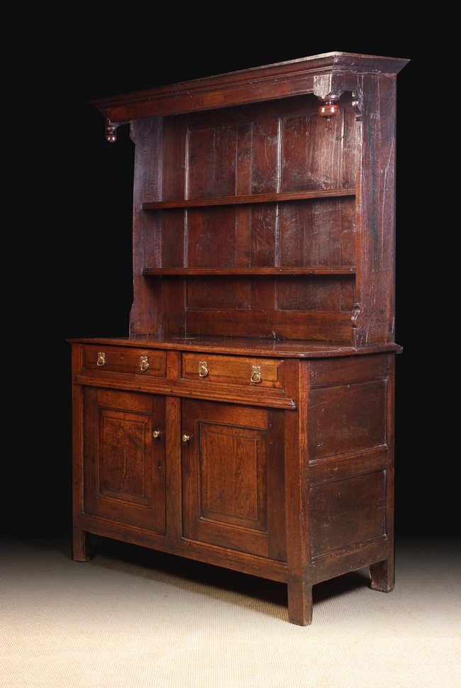 A Fine 18th Century Joined Oak Canopy Dresser of good colour and patination.