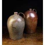 Two Large 19th Century Stoneware Flagons with ring turned shoulders and moulded strap handles;