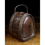 An 18th Century Chip Carved Wooden flask bound in iron straps and fitted with a wrythen iron swing