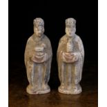 A Pair of Chinese Han Dynasty Pottery Tomb Figures, 7¼ ins (18.5 cms) in height.