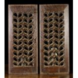 A Pair of Pierced Fretwork Panels of repeated design, 18¾ ins x 8 ins (47.5 cm x 20 cms).