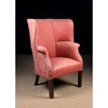 A Late Georgian Upholstered High-backed Tub Armchair covered in dark rose pink jacquard fabric