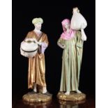 A Pair of Large Royal Worcester Patent Metallik Figures modelled as Eastern Water Carriers standing