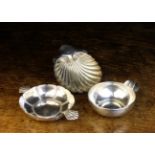 Three Small Silver Dishes: An antique French sommelier's wine tasting cup having a shallow bowl