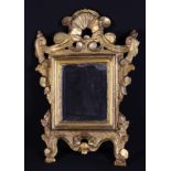 A 17th Century Venetian Carved Giltwood Mirror.