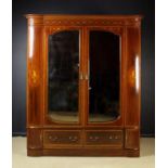 A Fine Quality Late 19th Century Inlaid Mahogany Wardrobe decorated with foliate sprays,