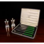 Two Silver Clad Pepper Grinders and a set of six green-handled butter knives.