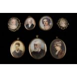 A Collection of Seven 19th Century Miniature Portraits in gilt metal frames: Two set in gold brooch