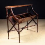 An Edwardian Mahogany Book Trough raised on fretted lattice end supports with turned legs united by
