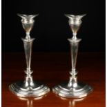 A Pair of Silver Candlesticks, hallmarked Sheffield 1919 with Walter Latham & Son makers' mark,
