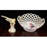 A Porcelain Basket with inter-woven trellis sides,