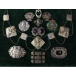 A Collection of Silver & Silver Coloured Art Nouveau Style Pendants and Buckles.
