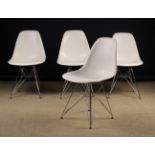 A Set of Four Vitra Eames White Polypropylene and Chrome Chairs after a 1950 design by Charles and