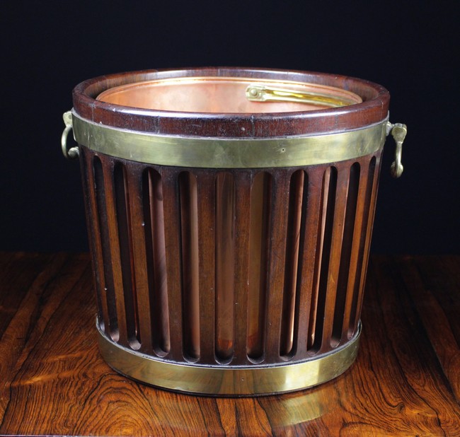 A Georgian Mahogany Plate Bucket with later copper liner.