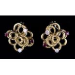 A Pair of 18 Carat Gold Earrings; the looped ropetwist set with rubies and diamonds.