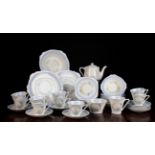 A Deco Style Fine Bone Bell China Teaset for nine place settings, decorated with sprays of yellow,