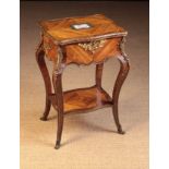 A Small 19th Century Work Table clad in diagonally grained tulip-wood veneers and adorned with gilt