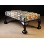 A Large & Imposing Upholstered Stool standing on foliate carved cabriole legs with bold ball & claw