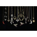 A Collection of Gold & Silver Coloured Necklaces & Pendants; four with 9 carat gold chains,