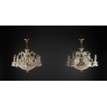 A Pair of Decorative Six Branch Bag Chandeliers: The scrolling electric 'candle' arms adorned with