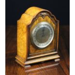 A 1930's Burr Walnut Mantel Clock retailed by Duff & Son Ltd,