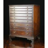 A Small 19th Century Mahogany Collector's Chest housing nine graduated drawers with brass stud