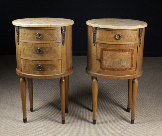 A Pair of Louis XVI Style Marble-topped Bedside Cabinets of oval form with decorative inlay.