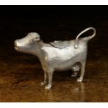 An 18th Century Russian Silver Cow Creamer having a hinged lid adorned with a bee encircled by