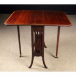 An Edwardian Mahogany Sutherland Table inlaid with satinwood cross-banding.