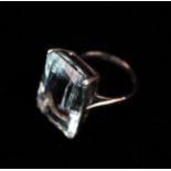 An Impressive Aquamarine & 18 Carat White Gold Ring set with a large rectangular stone.