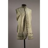 An 18th Century Ivory Silk Waistcoat Front embroidered with tiny pink silk flowers with chartreuse