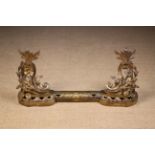 A Pair of 19th Century Gilt Chenets and a barre de foyer.