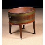 A George III Mahogany Wine Cooler.