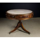 A Regency Style Mahogany Drum-topped Library Table.