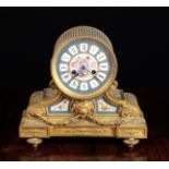 A Late 19th Century French Mantel Clock with Porcelain Insets.