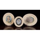 Three Ivory Framed Oval Miniatures: Two head and shoulder portraits of ladies;