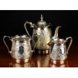 A Decorative Victorian Three Part Silver Plated Tea Service embossed and chased with scrolling