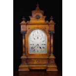 A Large & Impressive Late Victorian Oak Cased Mantel Clock striking a gong and eight bells.