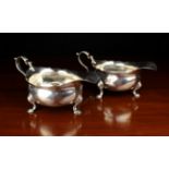 A Pair of George II Silver Creamers or Sauce Boats hallmarked indistinctly for London 1738.